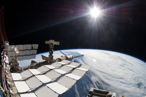 Framed Bright Sun, a Portion of the International Space Station and Earth's horizon Print