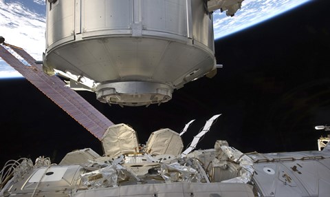 Framed Multipurpose Module in the grasp of Canadarm2 Print