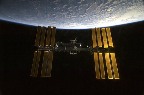 Framed International Space Station  Backdropped against Earth&#39;s Horizon Print