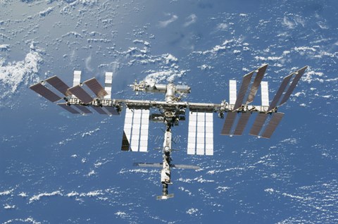 Framed International Space Station Backdropped by a Blue and White Part of Earth Print