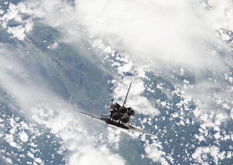 Framed Rear view of the Three main Engines of Space Shuttle Discovery as the Shuttle approaches the International Space Station Print