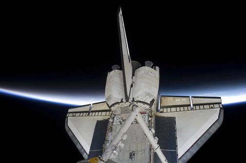 Framed Space Shuttle Discovery Intersecting the Thin line of Earth&#39;s Atmosphere, while Docked with the International Space Station Print