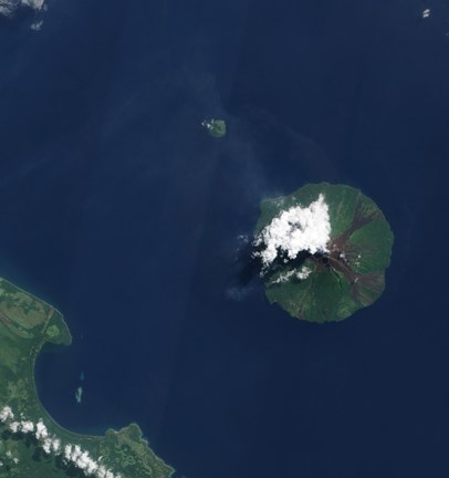 Framed Papua New Guinea&#39;s Manam Volcano releases a thin, Faint Plume over the Bismarch Sea Print