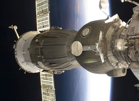 Framed Soyuz spacecraft backdropped by Earth Print