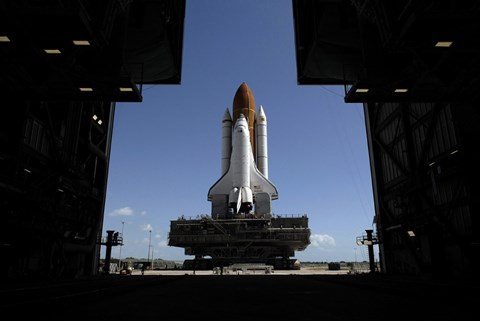 Framed Atlantis Rolls Toward the Open Doors of the Vehicle Assembly Building at Kennedy Space Center Print