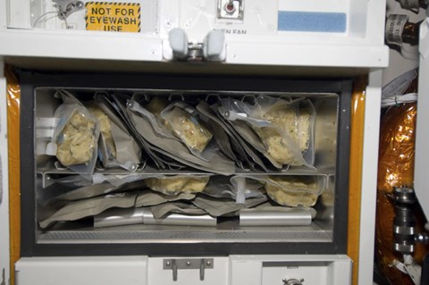 Framed Bags of Food Stored Inside the Galley on Space Shuttle Endeavour Print