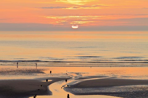 Framed Sunset and beach, Blackpool, England Print