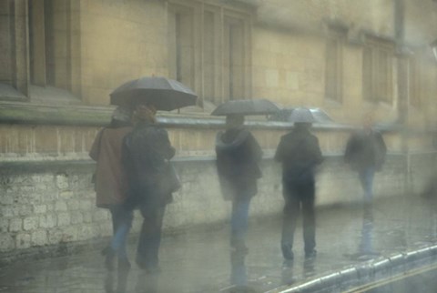 Framed Walking in the rain, Oxford University, England Print