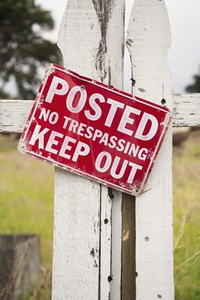 Framed Red No Treaspassing Sign on a Fence Post Print