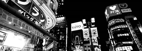 Framed Low angle view of buildings lit up at night, Tokyo, Japan Print