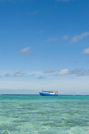 Framed Fishing boat in the turquoise waters of the blue lagoon, Fiji Print