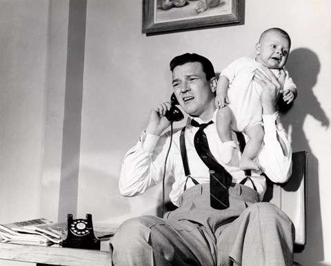 Framed 1950s Father Holding Baby While On The Phone Print