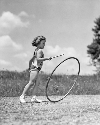 Framed 1930s Girl Outdoors Playing Hoop And Stick Game Print