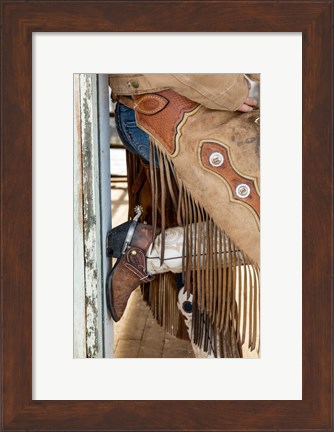 Framed Cowgirl Standing In Doorway Of Old Log Cabin Print