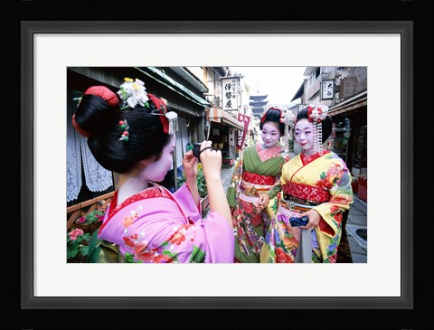 Framed Three geishas, Kyoto, Honshu, Japan (taking pictures) Print