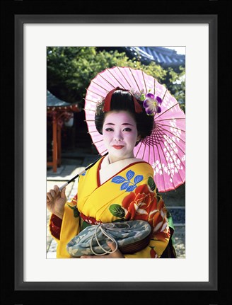 Framed Geisha holding a parasol, Kyoto, Japan Print
