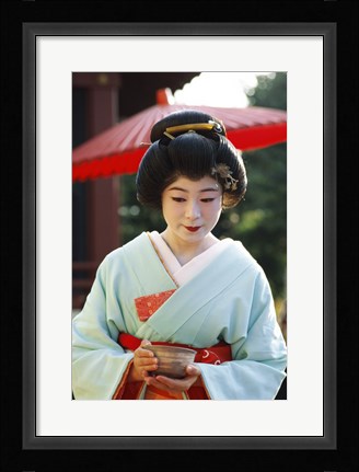 Framed Young woman dressed as a Geisha, Japan Print