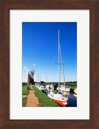 Framed Boats moored near a traditional windmill, Horsey Windpump, Horsey, Norfolk Broads, Norfolk, England Print