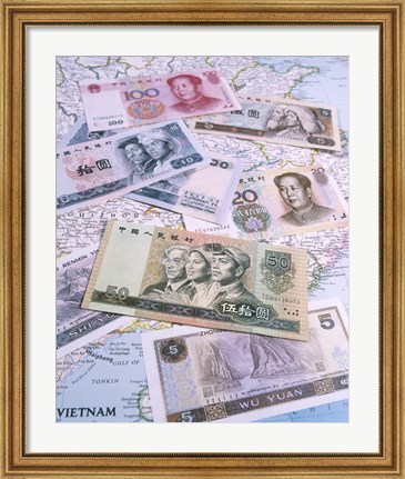 Framed Close-up of yuan notes on a map Print