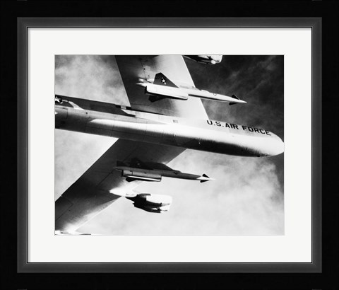 Framed Low angle view of a bomber plane carrying missiles during fight, AGM-28 Hound Dog, B-52 Stratofortress Print