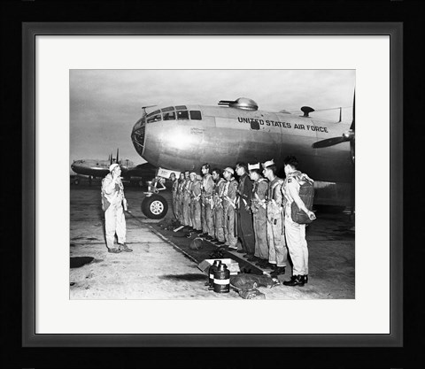 Framed Group of army soldiers standing in a row near a fighter plane, B-29 Superfortress Print