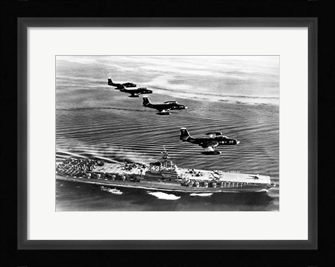 Framed High angle view of four fighter planes flying over an aircraft carrier, US Navy Banshees, USS Coral Sea (CV-43) Print