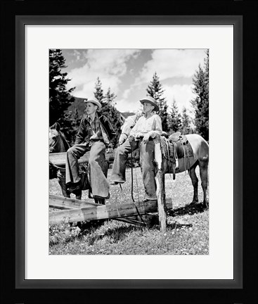 Framed Teenage cowboys sitting on rail fence Print