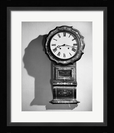 Framed Close-up of clock hanging on wall Print