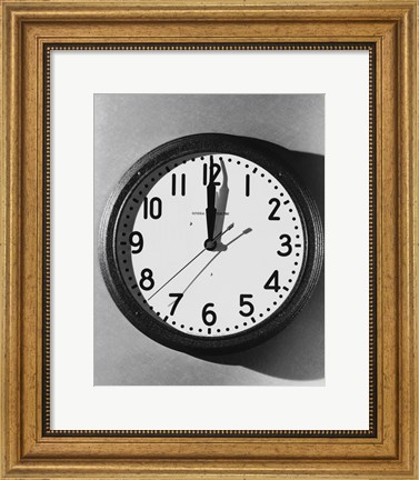 Framed Close-up of a wall clock hanging on a wall Print