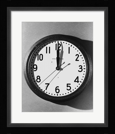 Framed Close-up of a wall clock hanging on a wall Print