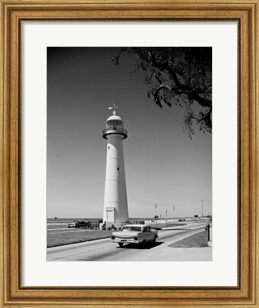 Framed USA, Mississippi, Biloxi, Biloxi Lighthouse with street in the foreground Print
