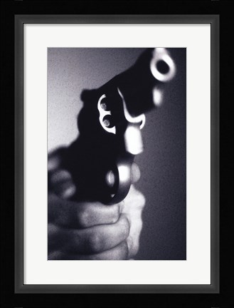 Framed Close-up of a person holding a handgun Print
