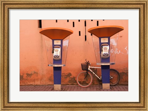 Framed Public telephone booths in front of a wall, Morocco Print
