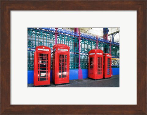 Framed Four telephone booths near a grille, London, England Print