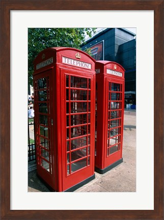 Framed Two telephone booths, London, England Print