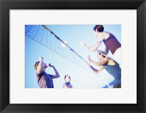 Framed Low angle view of two young couples playing beach volleyball Print