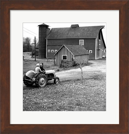 Framed Man with a Boy Riding a Tractor in a Field Print