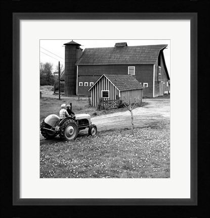 Framed Man with a Boy Riding a Tractor in a Field Print