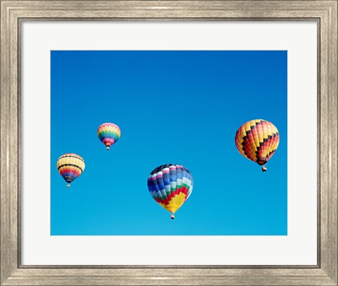 Framed 4 Rainbow Hot Air Balloons in the Bright Blue Sky Print
