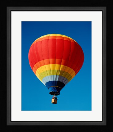 Framed Low angle view of a hot air balloon in the sky, New Mexico, Rainbow Print