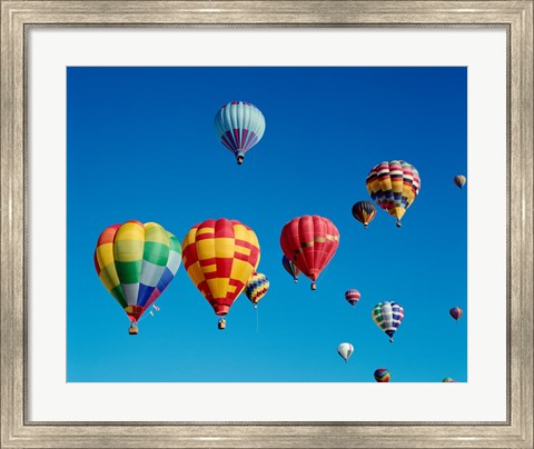 Framed Low angle view of a group of hot air balloons in the sky Print