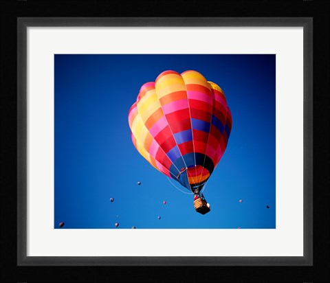 Framed Lone Hot Air Balloon with Other Hot Air Balloons in the Distance Print