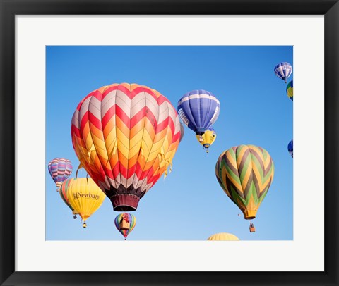 Framed Low angle view of hot air balloons in the sky Print
