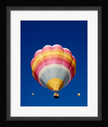 Framed Low Angle Shot of a Rainbow Hot Air Balloon Print
