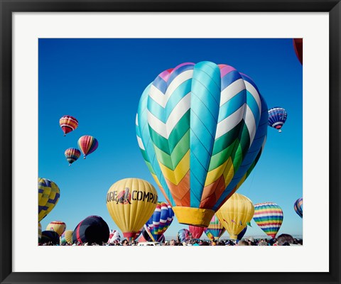 Framed Low angle view of hot air balloons taking off, Albuquerque International Balloon Fiesta, Albuquerque, New Mexico, USA Print