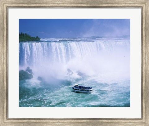 Framed High angle view of a tourboat in front of a waterfall, Niagara Falls, Ontario, Canada Print