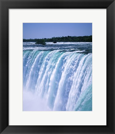 Framed Water flowing over Niagara Falls, Ontario, Canada Print