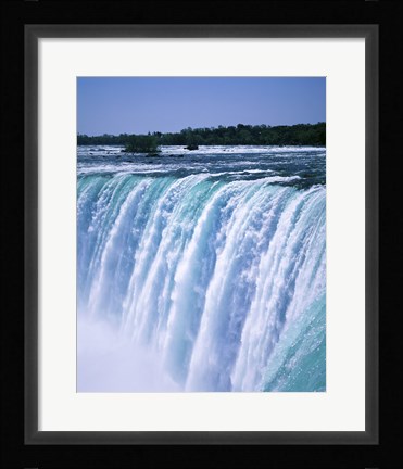 Framed Water flowing over Niagara Falls, Ontario, Canada Print