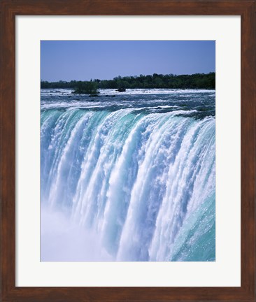 Framed Water flowing over Niagara Falls, Ontario, Canada Print