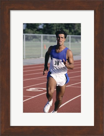 Framed Male athlete running on a running track Print